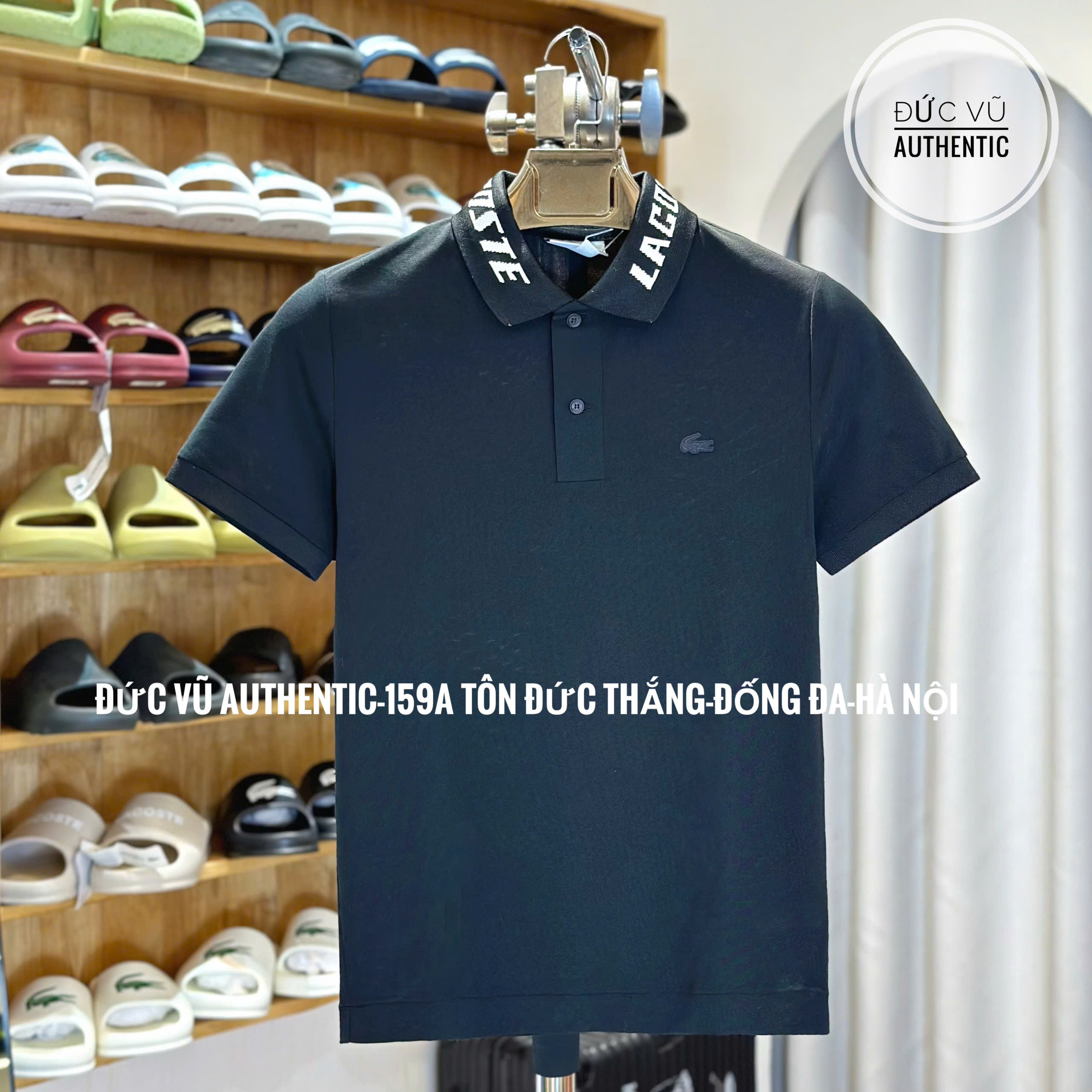 Áo polo nam Lacoste đen cổ chữ – phong cách thể thao hiện đại