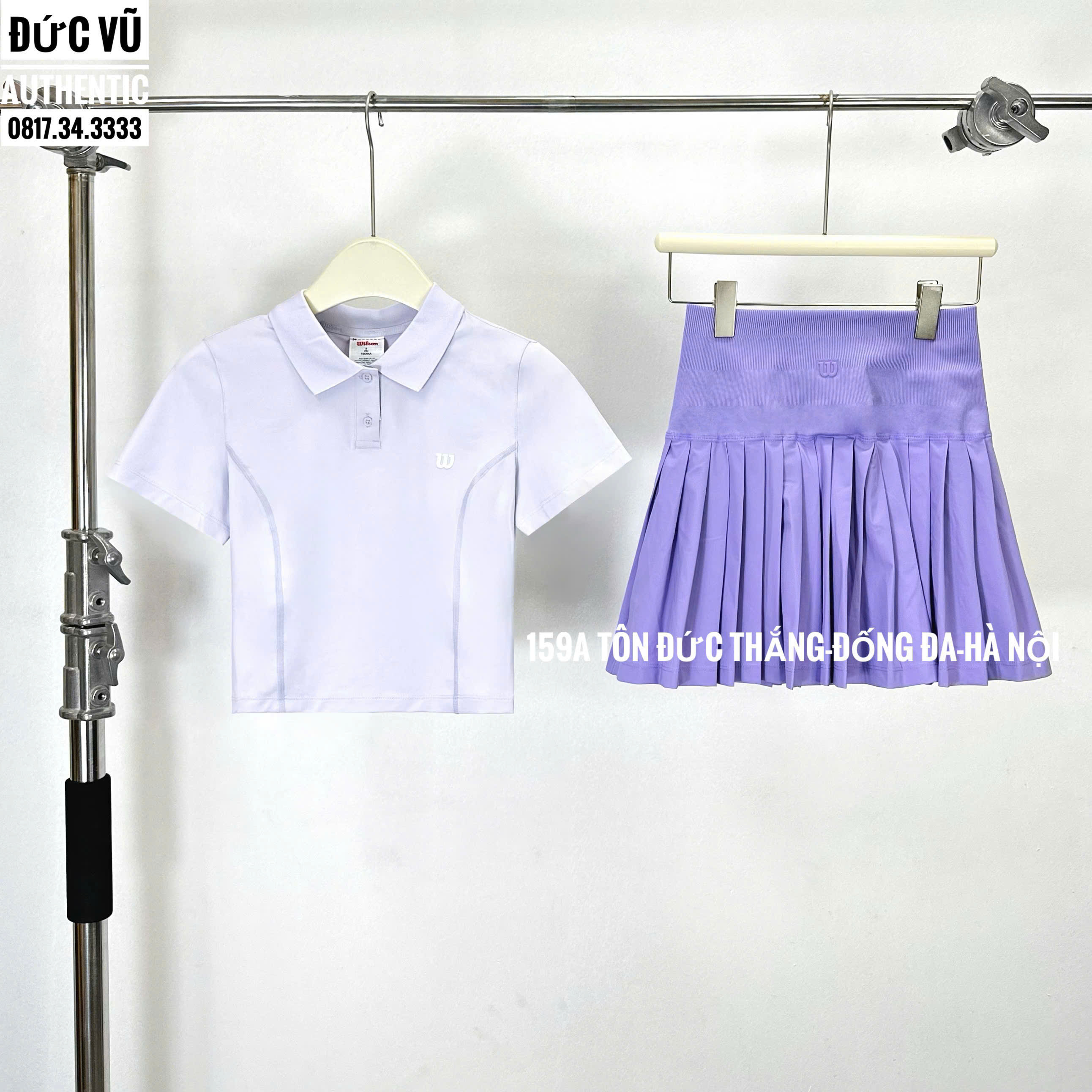 Set tennis nữ áo polo trắng & chân váy xếp ly tím Wilson