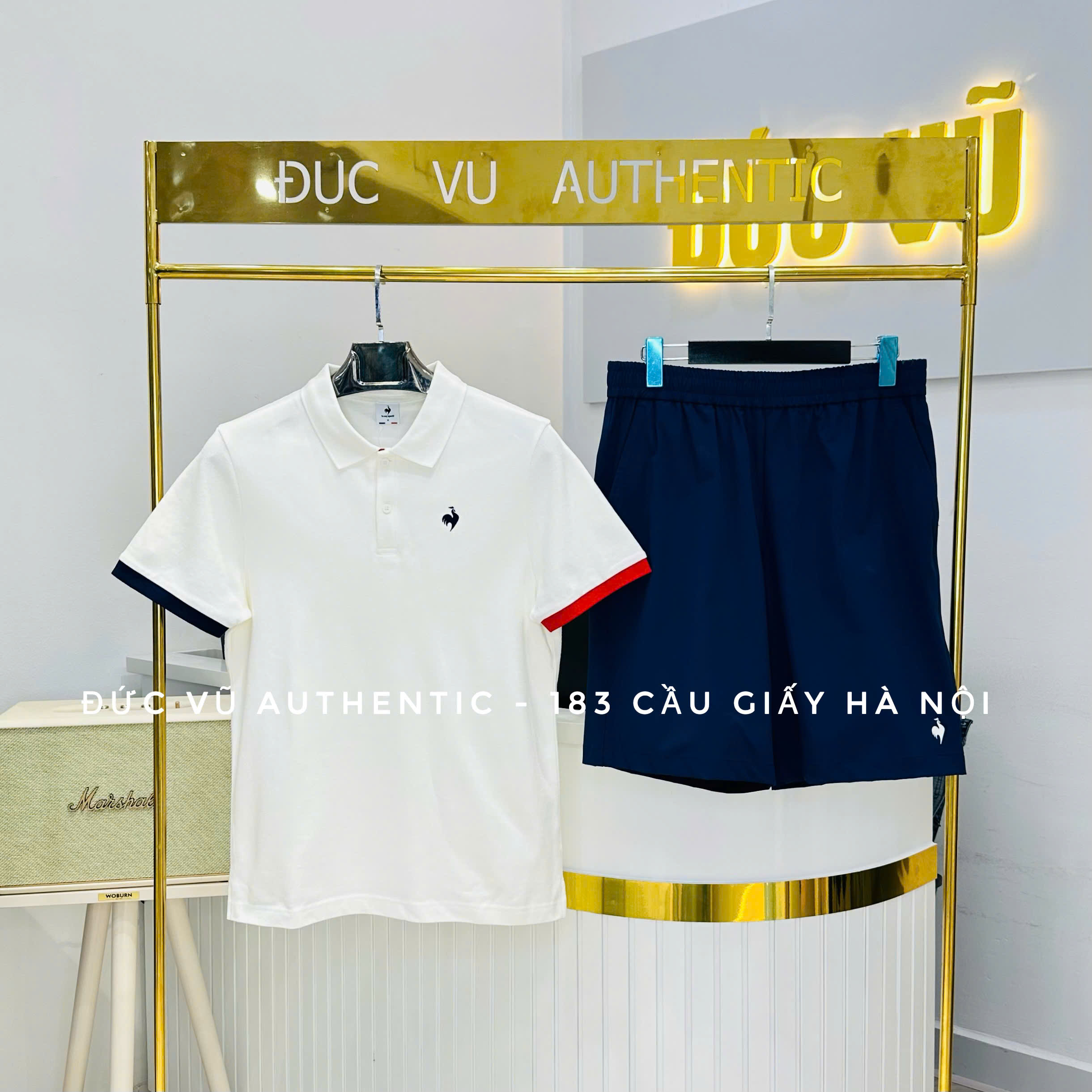 Bộ đồ thể thao nam Le Coq Sportif polo trắng tay phối navy/đỏ – short xanh navy