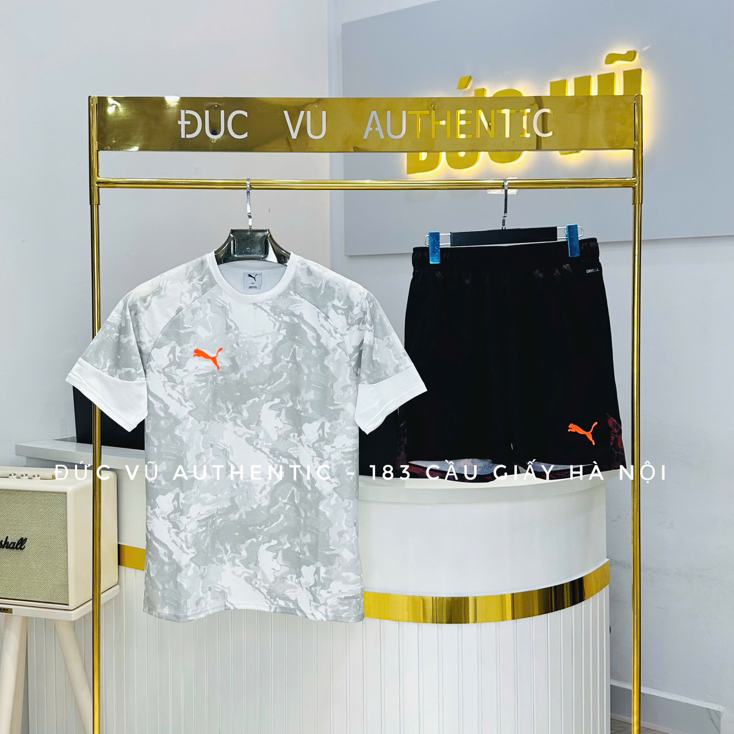 Set thể thao Puma họa tiết camo phối cam nổi bật