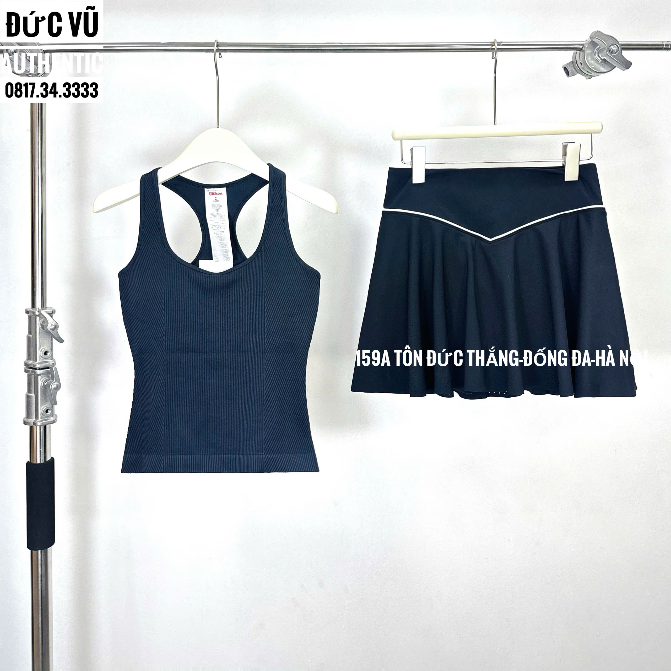 Set thể thao nữ tank top & chân váy xếp ly đen viền trắng