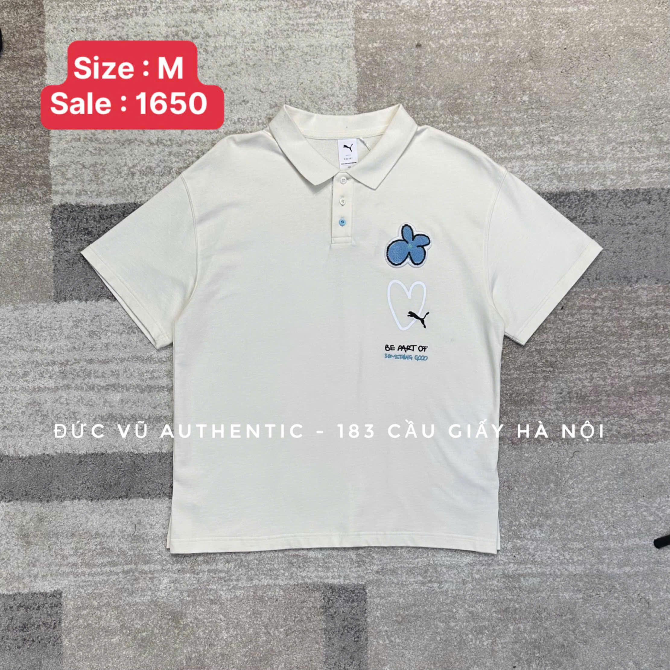 Áo polo Puma "Be Part Of Something Good" – Trắng kem