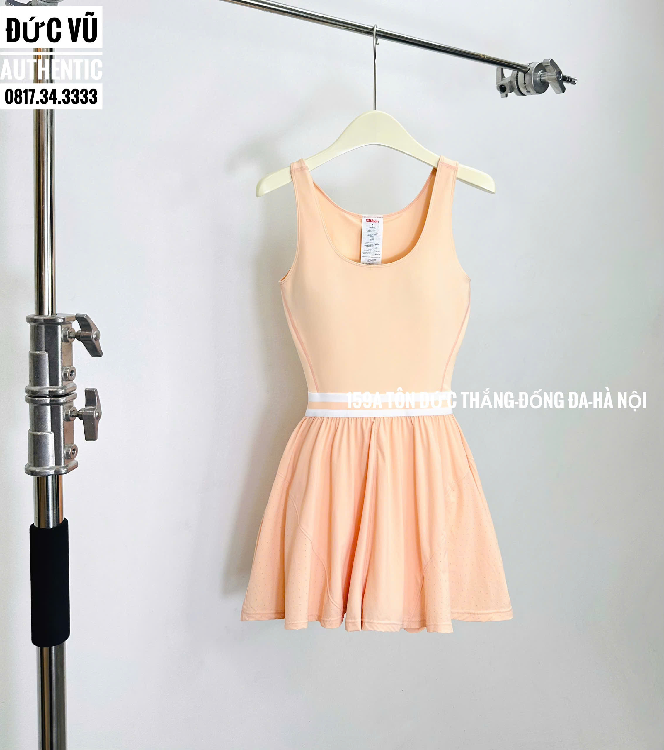 Đầm thể thao nữ Wilson cam pastel liền thân eo bo sọc