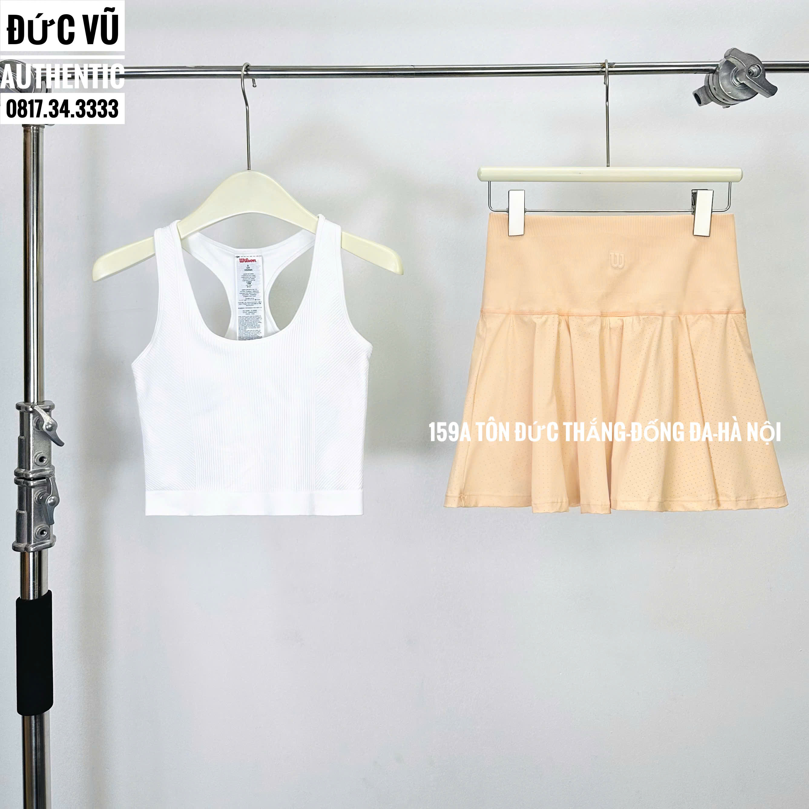 Set thể thao nữ croptop trắng & chân váy xòe cam pastel Wilson
