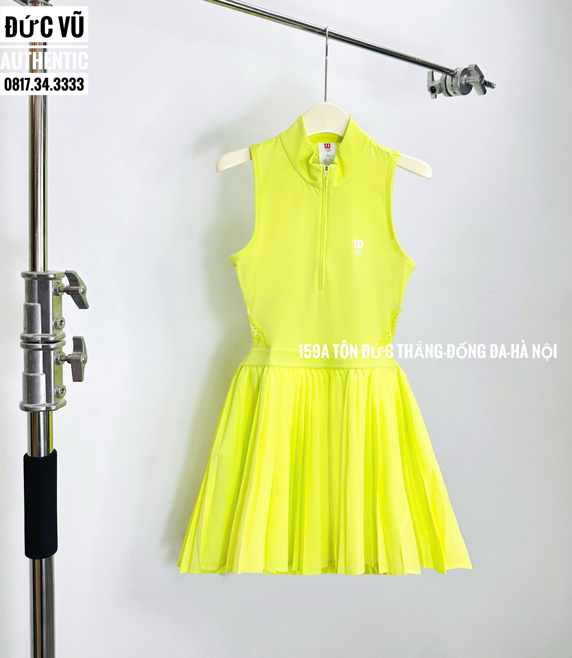 Đầm tennis nữ Wilson vàng neon cổ zip không tay