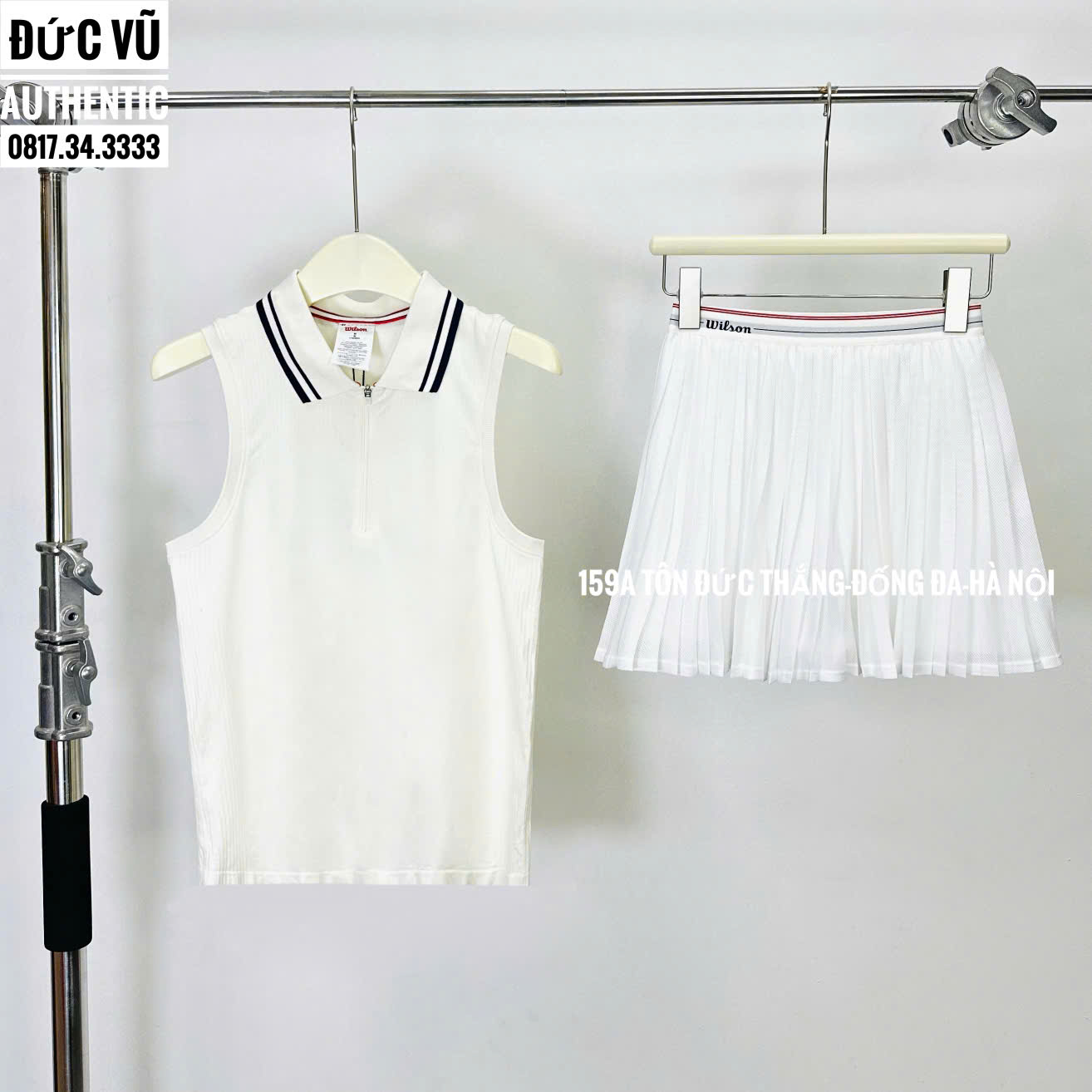 Set tennis nữ Wilson phối cổ viền đen – áo không tay + chân váy xếp ly trắng