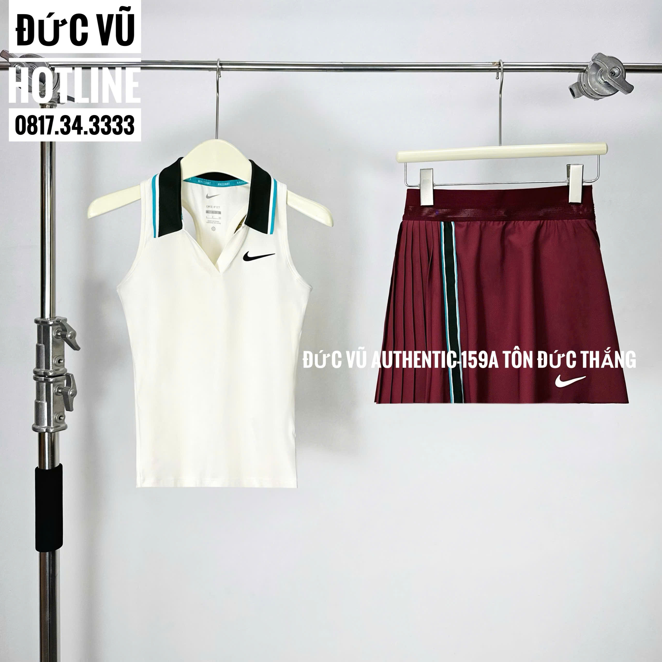 Set tennis nữ Nike – áo polo không tay trắng phối cổ đen viền xanh, chân váy đỏ đô