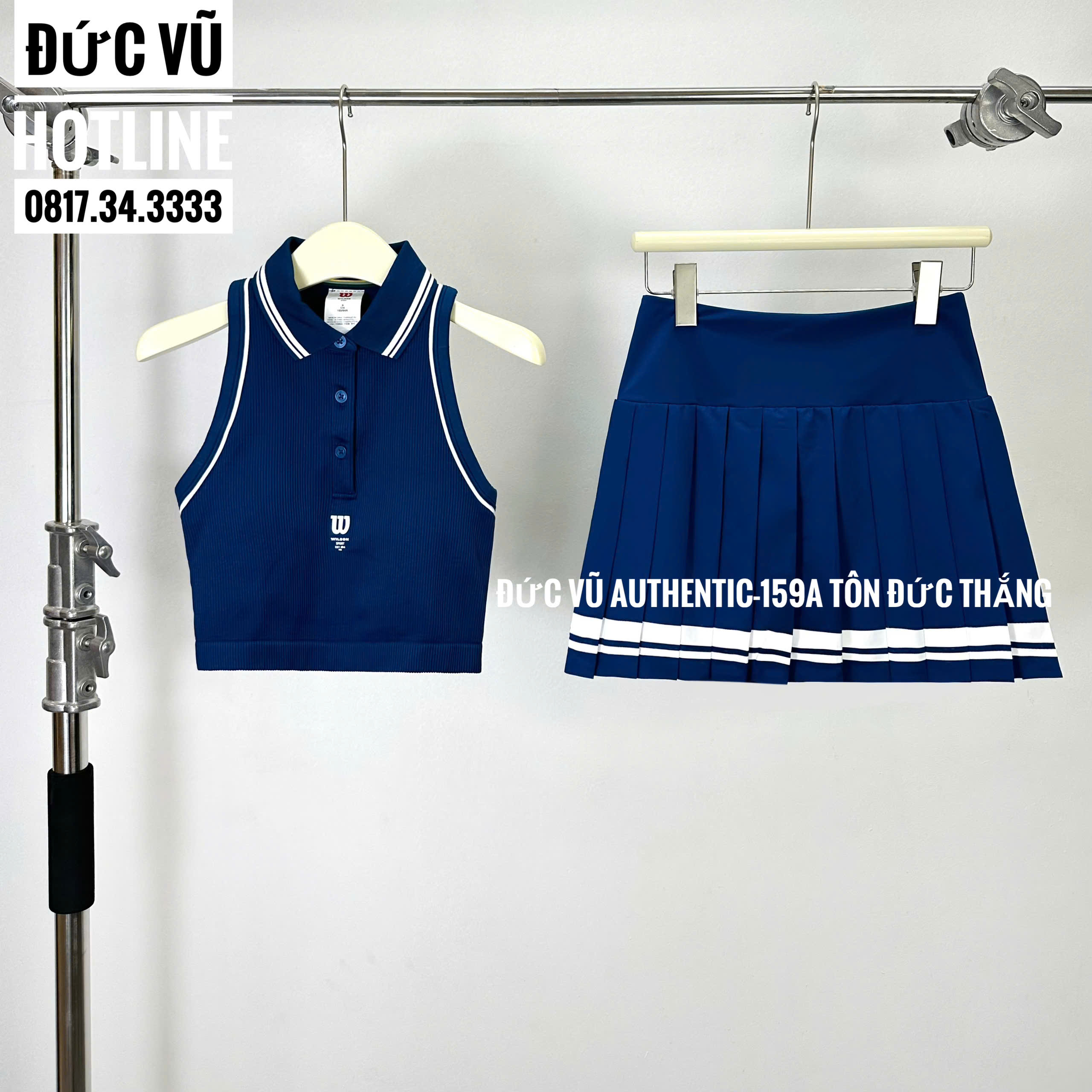 Set tennis nữ Wilson xanh navy (croptop polo + chân váy xếp ly)