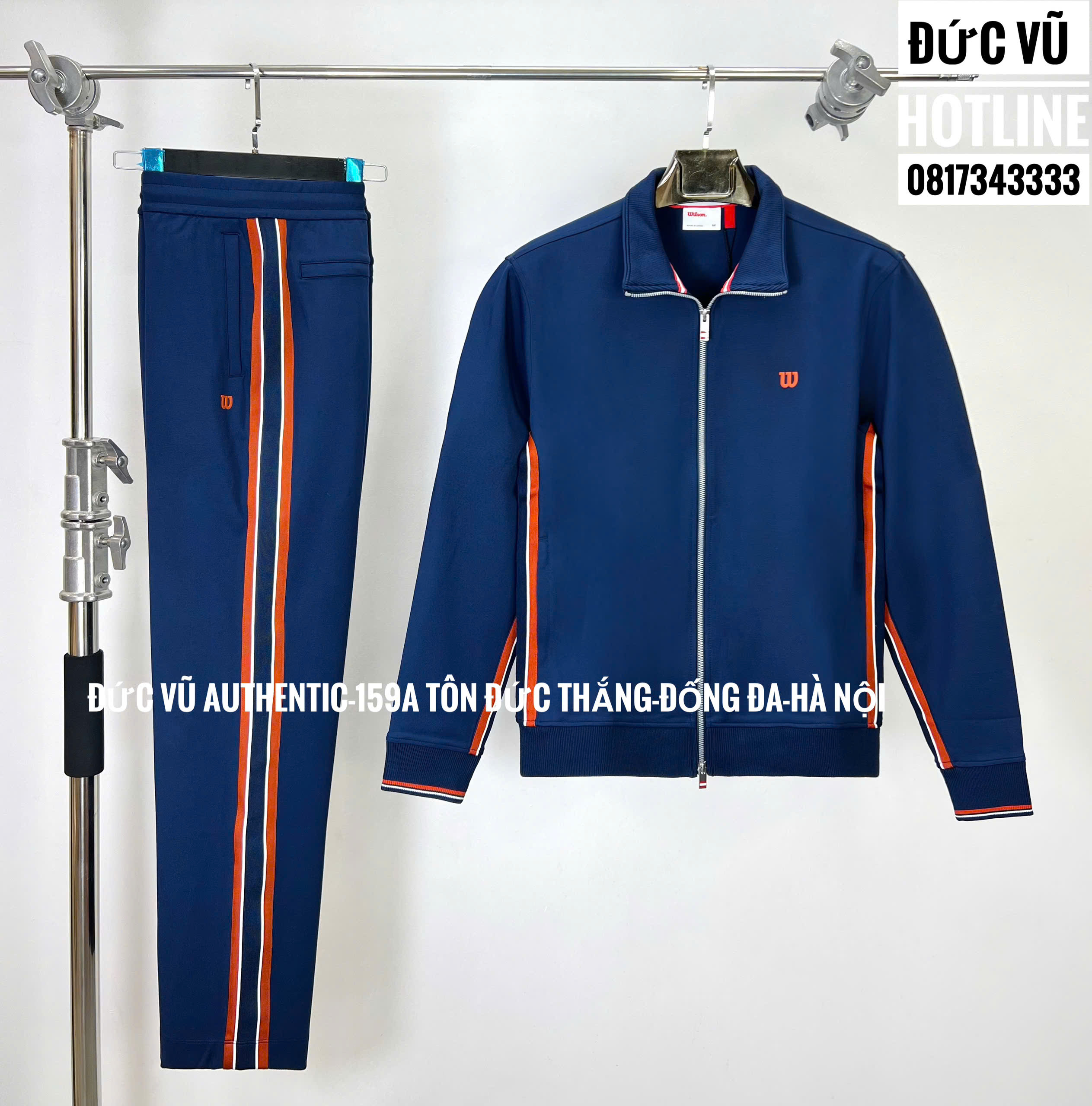 Bộ nỉ thể thao Wilson – Navy sọc cam trắng