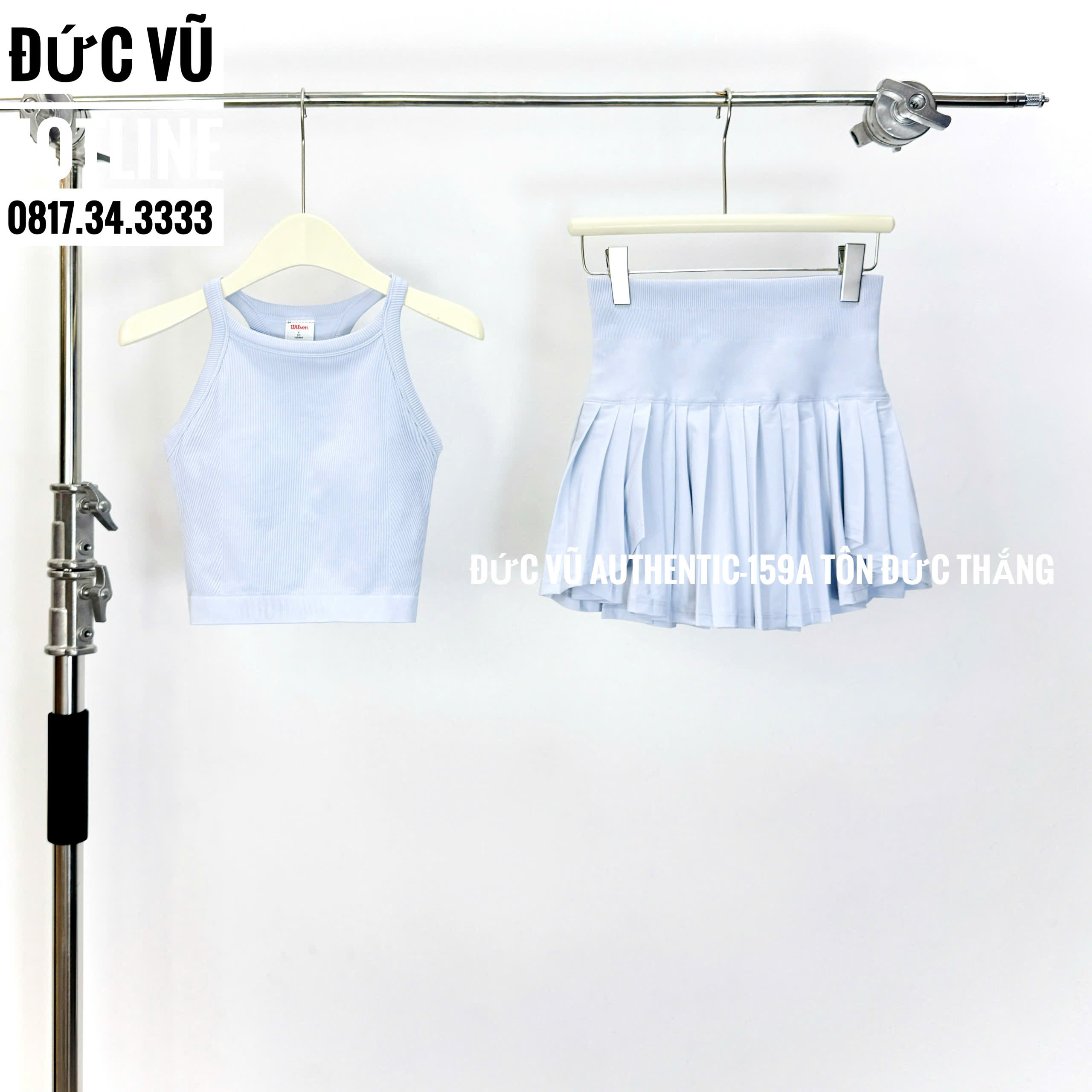 Set thể thao nữ Wilson dáng tennis – áo croptop và chân váy xếp ly màu xanh baby